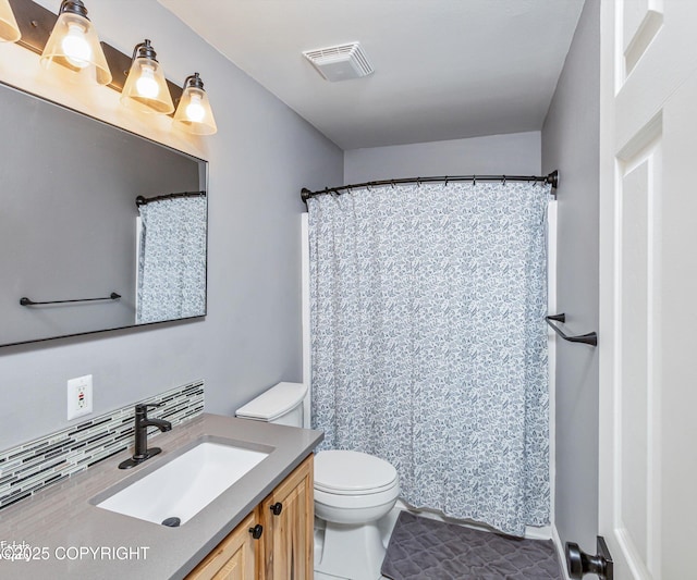 25656 Bendilent Cir, Eagle River, AK 99577 - full bathroom featuring toilet, vanity, and visible vents