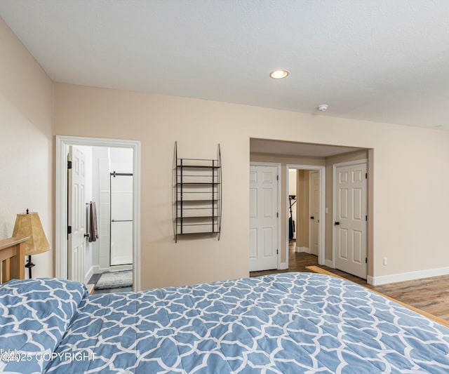 25656 Bendilent Cir, Eagle River, AK 99577 - bedroom with recessed lighting, baseboards, and wood finished floors