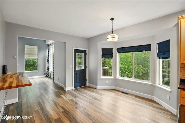 25656 Bendilent Cir, Eagle River, AK 99577 - foyer with wood finished floors, baseboards, and plenty of natural light