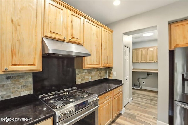 25656 Bendilent Cir, Eagle River, AK 99577 - kitchen with under cabinet range hood, stainless steel appliances, light wood-style flooring, and backsplash