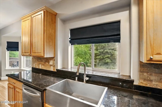 25656 Bendilent Cir, Eagle River, AK 99577 - kitchen with a sink, healthy amount of natural light, stainless steel dishwasher, and decorative backsplash