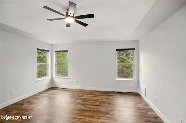 25656 Bendilent Cir, Eagle River, AK 99577 - empty room with ceiling fan, wood finished floors, and baseboards