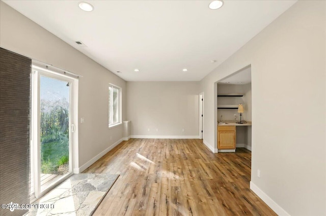 25656 Bendilent Cir, Eagle River, AK 99577 - unfurnished room featuring light wood-style floors, recessed lighting, and baseboards