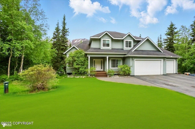 25656 Bendilent Cir, Eagle River, AK 99577 - view of front of property with a porch, an attached garage, driveway, and a front lawn