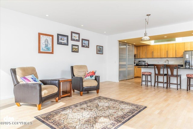 1382 Northbluff Dr # 4B, Anchorage, AK 99501 - living area featuring light wood-style flooring, baseboards, and recessed lighting