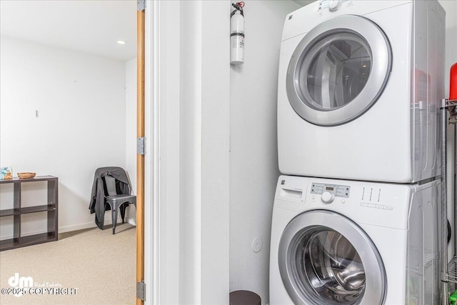 1382 Northbluff Dr # 4B, Anchorage, AK 99501 - clothes washing area with stacked washer / drying machine, recessed lighting, carpet, laundry area, and baseboards