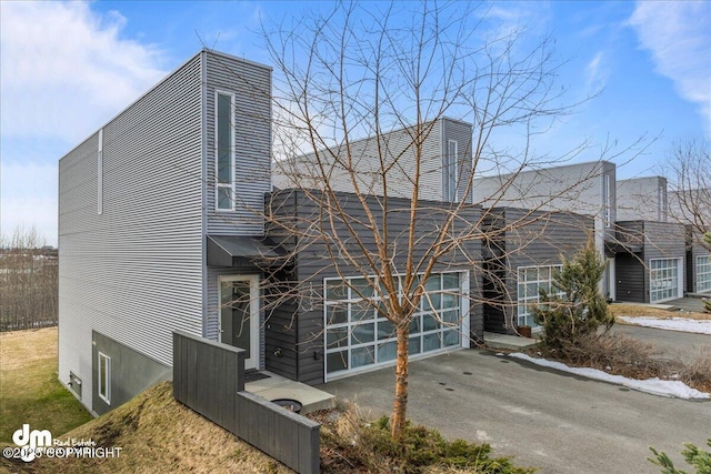 1382 Northbluff Dr # 4B, Anchorage, AK 99501 - view of front of house featuring a garage and driveway