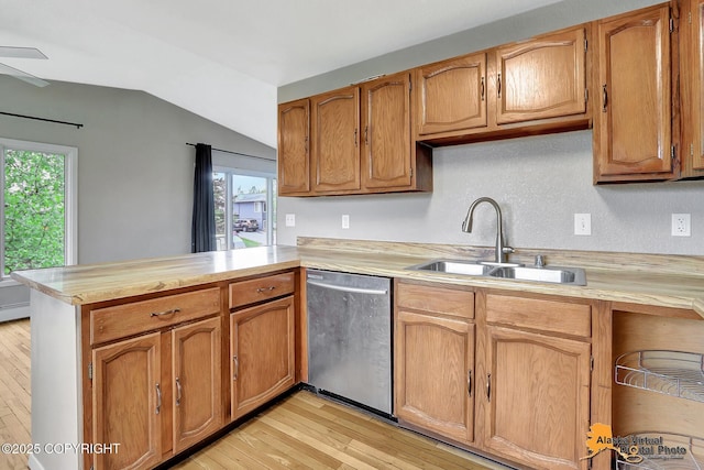 8400 E 11th Ct, Anchorage, AK 99504 - kitchen featuring stainless steel dishwasher, a sink, light countertops, and a peninsula