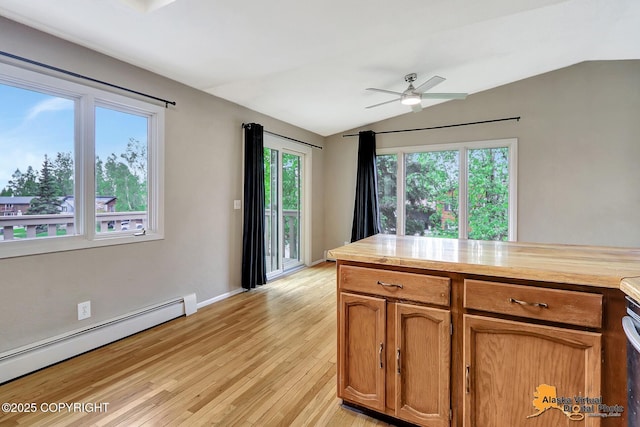 8400 E 11th Ct, Anchorage, AK 99504 - kitchen featuring a baseboard radiator, lofted ceiling, butcher block countertops, light wood-style floors, and ceiling fan