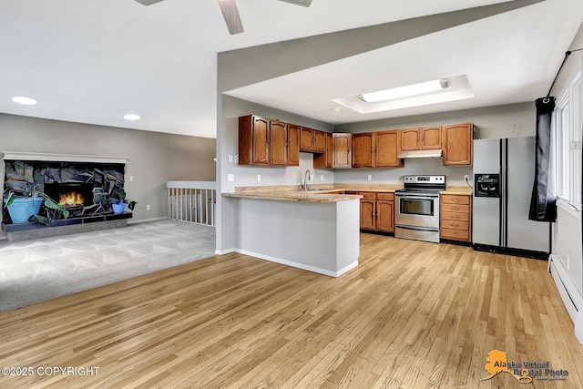 8400 E 11th Ct, Anchorage, AK 99504 - kitchen with appliances with stainless steel finishes, a sink, light countertops, light wood-type flooring, and baseboards