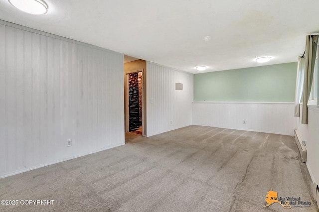 8400 E 11th Ct, Anchorage, AK 99504 - carpeted empty room with baseboard heating