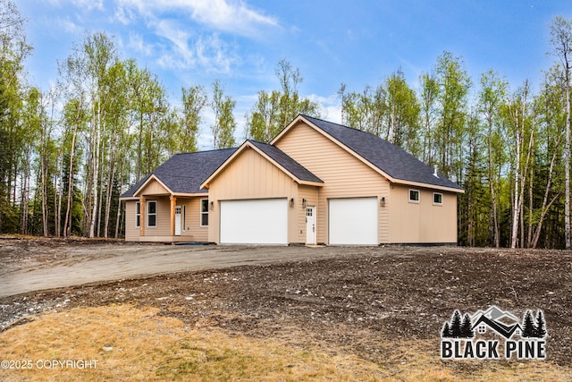 5236 W Hidden Paradise Rd, Wasilla, AK 99623 - view of front of property featuring roof with shingles and an attached garage