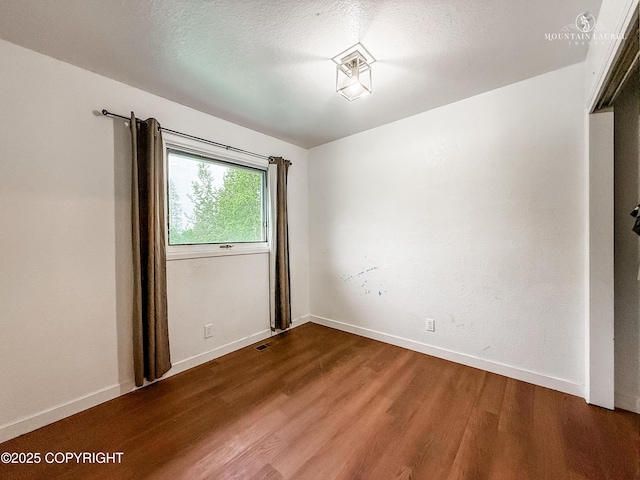 6934 Inlet Vista Dr, Wasilla, AK 99623 - empty room with wood finished floors and baseboards