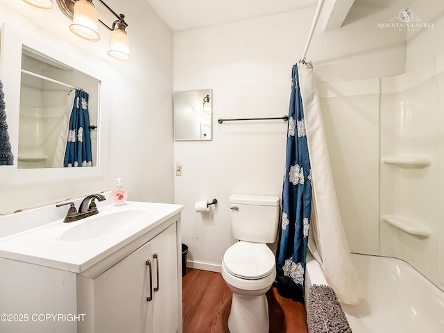 6934 Inlet Vista Dr, Wasilla, AK 99623 - full bathroom featuring wood finished floors, vanity, and shower / bath combo with shower curtain