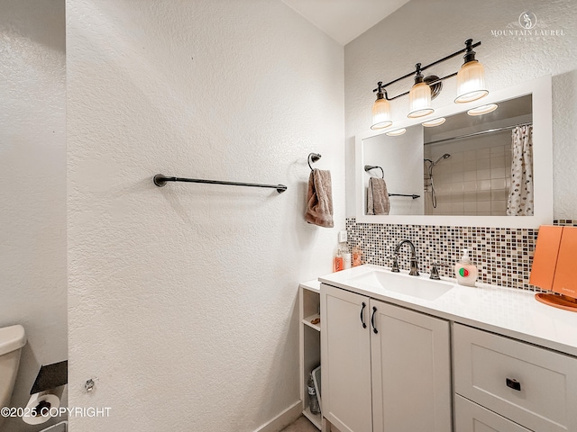6934 Inlet Vista Dr, Wasilla, AK 99623 - full bathroom with backsplash, vanity, a textured wall, and curtained shower