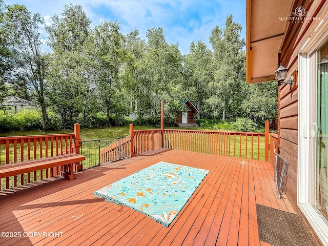6934 Inlet Vista Dr, Wasilla, AK 99623 - wooden terrace with a yard and view of wooded area