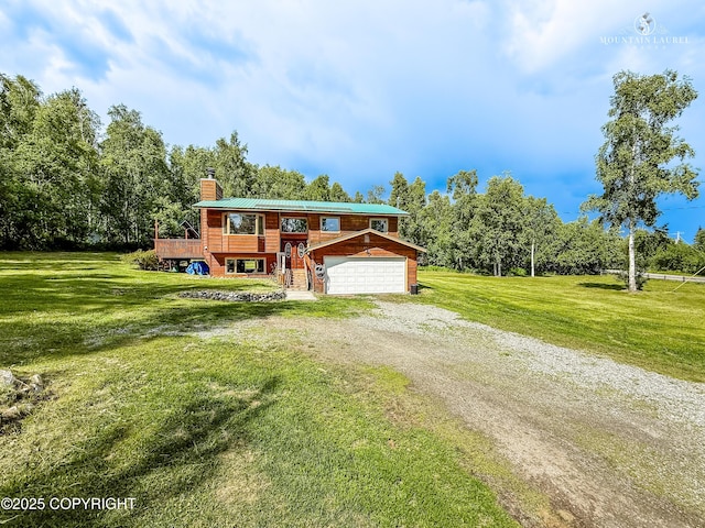 6934 Inlet Vista Dr, Wasilla, AK 99623 - raised ranch featuring a chimney, driveway, a garage, and a front yard