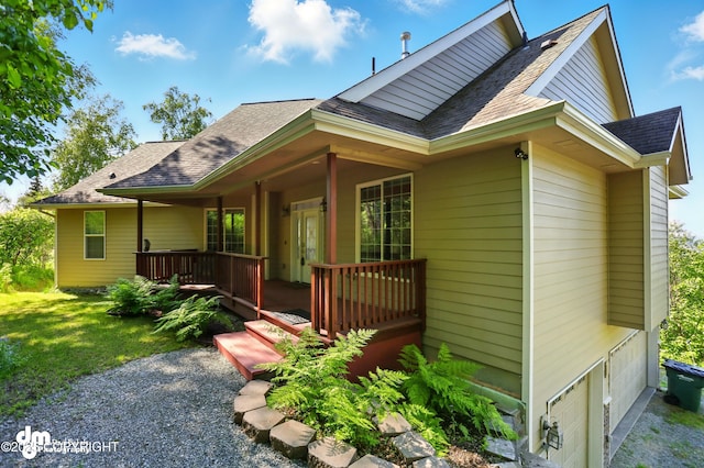 18221 Amonson Rd, Chugiak, AK 99567 - view of side of home with a shingled roof and a lawn