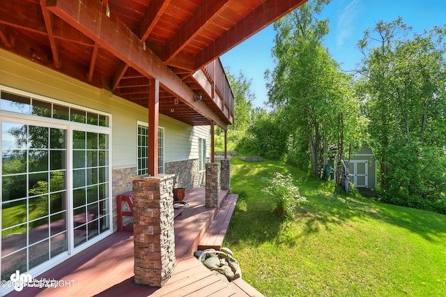 18221 Amonson Rd, Chugiak, AK 99567 - view of green lawn featuring a storage unit and a deck