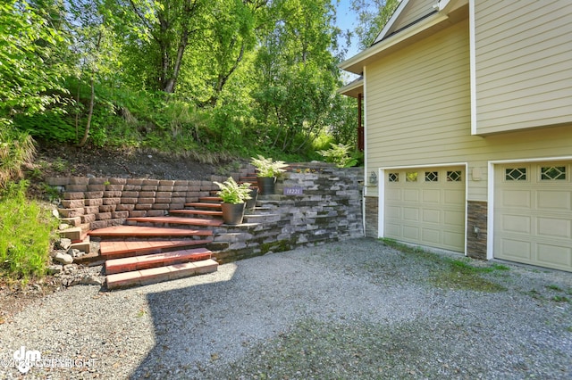 18221 Amonson Rd, Chugiak, AK 99567 - view of yard with a garage and driveway