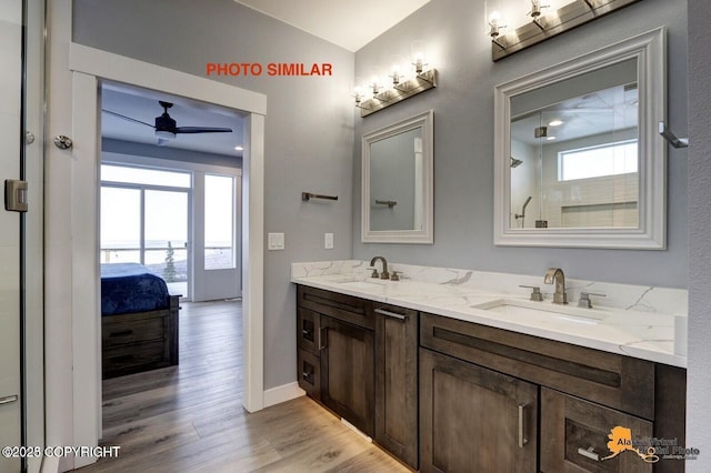 16074 Mountain Air Dr, Anchorage, AK 99516 - ensuite bathroom featuring plenty of natural light, ceiling fan, double vanity, and wood finished floors