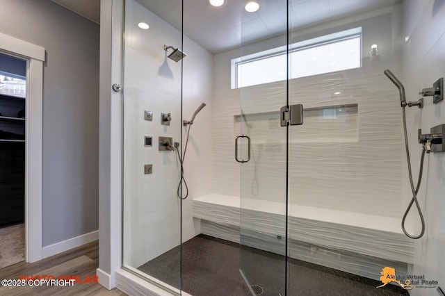 16074 Mountain Air Dr, Anchorage, AK 99516 - bathroom with a shower stall, wood finished floors, recessed lighting, and baseboards