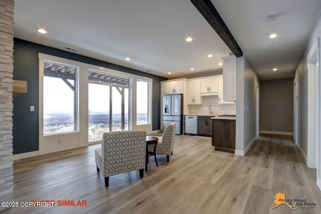 16074 Mountain Air Dr, Anchorage, AK 99516 - dining area with light wood finished floors, baseboards, and recessed lighting
