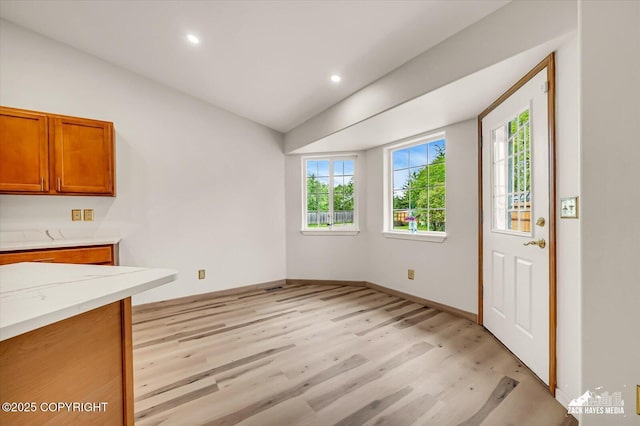 11510 Tulin Park Loop, Anchorage, AK 99516 - unfurnished dining area with light wood finished floors, recessed lighting, and baseboards