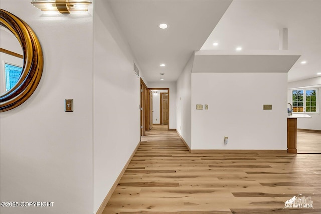 11510 Tulin Park Loop, Anchorage, AK 99516 - hallway with recessed lighting, light wood-style flooring, and baseboards
