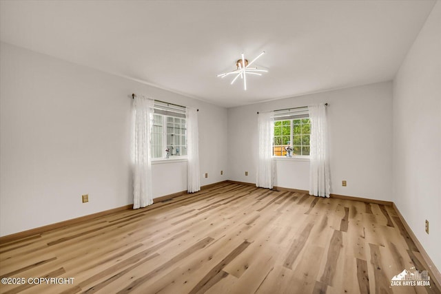 11510 Tulin Park Loop, Anchorage, AK 99516 - unfurnished room featuring light wood-style flooring and baseboards