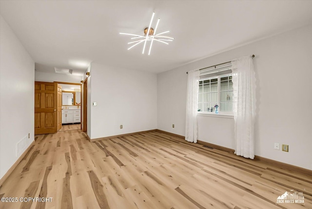 11510 Tulin Park Loop, Anchorage, AK 99516 - unfurnished room featuring light wood-type flooring and baseboards