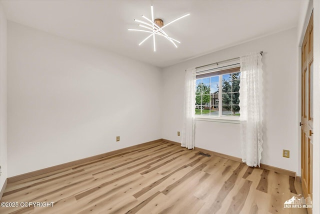 11510 Tulin Park Loop, Anchorage, AK 99516 - empty room with light wood-type flooring and baseboards