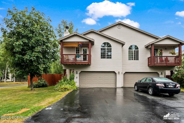 2578 Glacier St # 8, Anchorage, AK 99508 - view of front of property with a garage, a balcony, asphalt driveway, and a chimney