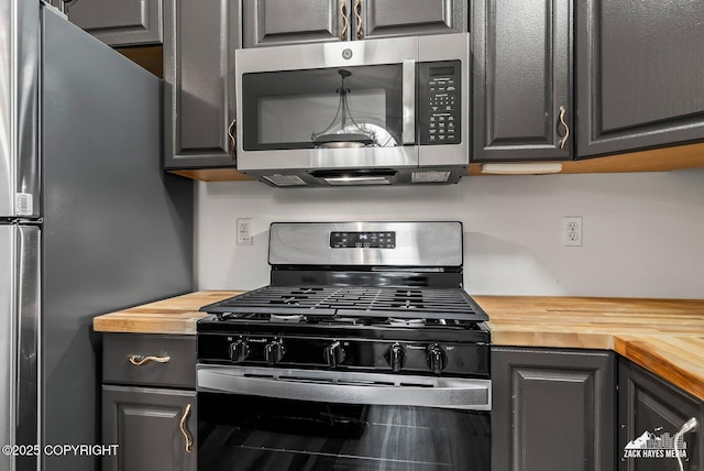 2578 Glacier St # 8, Anchorage, AK 99508 - kitchen with stainless steel appliances and butcher block countertops