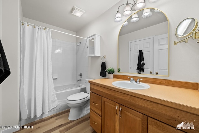 2578 Glacier St # 8, Anchorage, AK 99508 - full bath featuring vanity, shower / bath combo, and wood finished floors