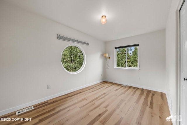 2578 Glacier St # 8, Anchorage, AK 99508 - empty room featuring baseboards and wood finished floors