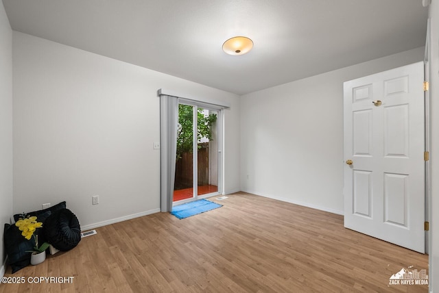 2578 Glacier St # 8, Anchorage, AK 99508 - unfurnished room featuring light wood-style flooring and baseboards