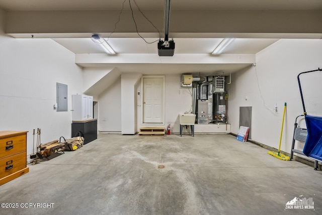2578 Glacier St # 8, Anchorage, AK 99508 - garage featuring a garage door opener, electric panel, and water heater