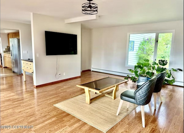 19440 Timberline Dr, Eagle River, AK 99577 - living room with a baseboard heating unit, light wood finished floors, and a baseboard radiator