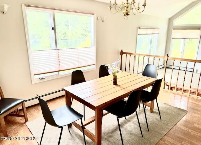 19440 Timberline Dr, Eagle River, AK 99577 - dining space featuring a chandelier, baseboard heating, and healthy amount of natural light