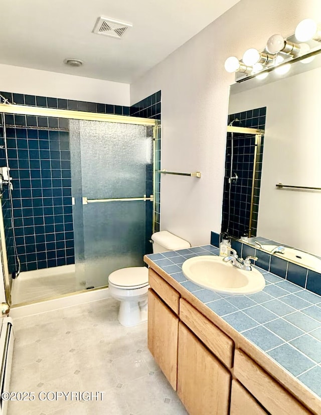 19440 Timberline Dr, Eagle River, AK 99577 - bathroom with vanity, a stall shower, and baseboard heating