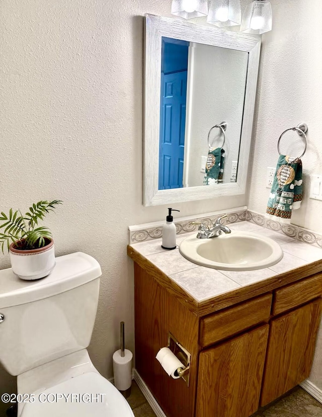 19440 Timberline Dr, Eagle River, AK 99577 - half bathroom with vanity and a textured wall