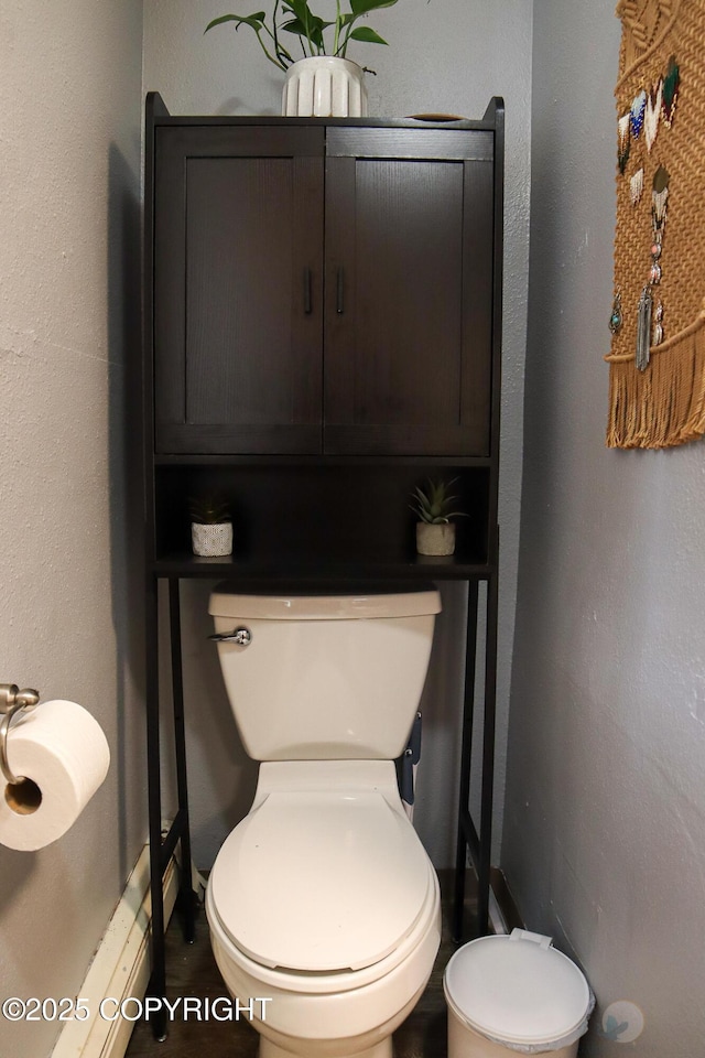 1468 Davison Rd, North Pole, AK 99705 - bathroom with baseboard heating, toilet, and baseboards