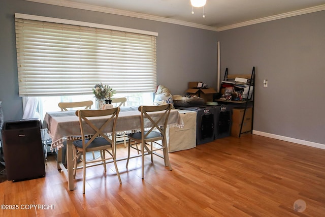 1468 Davison Rd, North Pole, AK 99705 - dining room with baseboards, wood finished floors, and ornamental molding