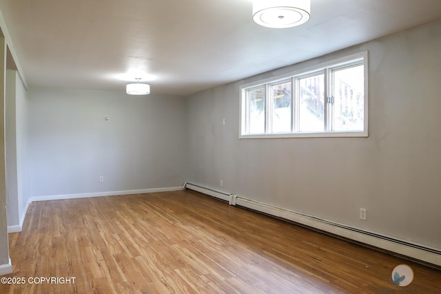 1468 Davison Rd, North Pole, AK 99705 - below grade area featuring baseboards, light wood-style flooring, and baseboard heating