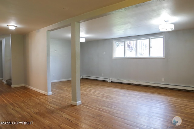 1468 Davison Rd, North Pole, AK 99705 - below grade area featuring baseboards, baseboard heating, and wood finished floors
