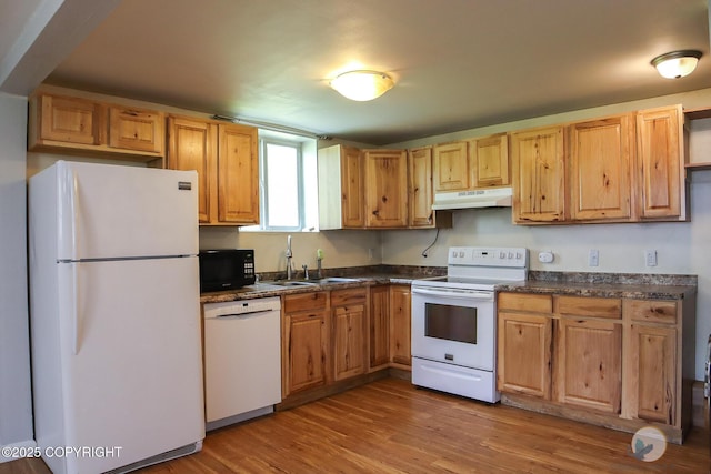 1468 Davison Rd, North Pole, AK 99705 - kitchen featuring under cabinet range hood, white appliances, a sink, and dark countertops