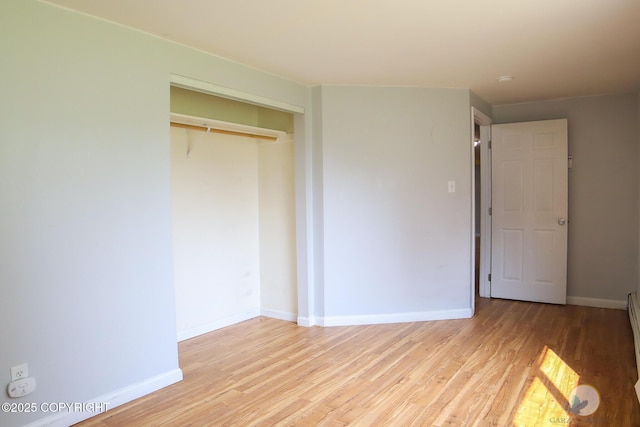 1468 Davison Rd, North Pole, AK 99705 - unfurnished bedroom with light wood-type flooring, a closet, and baseboards