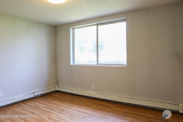 1468 Davison Rd, North Pole, AK 99705 - empty room featuring light wood finished floors and baseboard heating