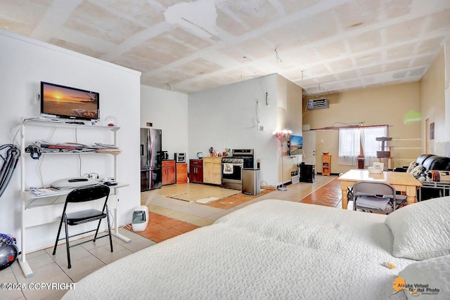 bedroom with light tile patterned floors and black fridge with ice dispenser